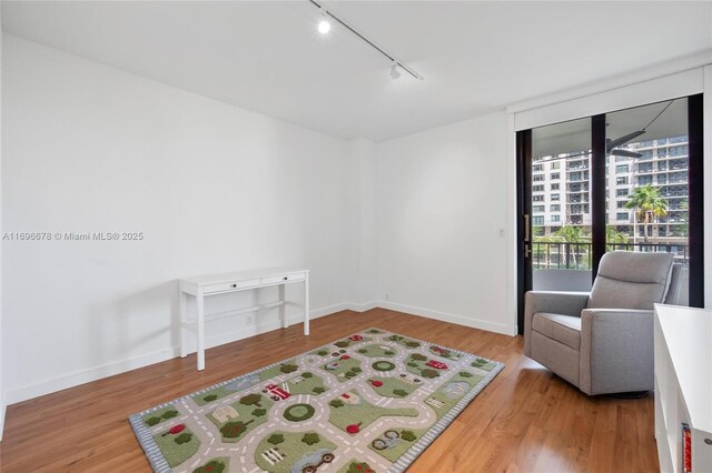 bedroom with a closet and hardwood / wood-style floors