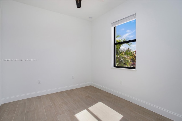 unfurnished room with light hardwood / wood-style flooring