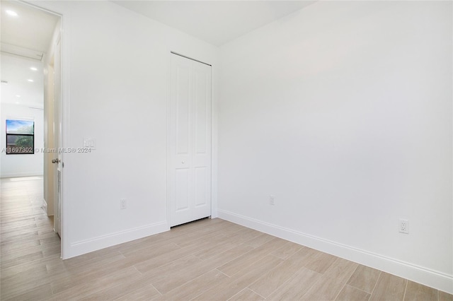 spare room with light wood-type flooring