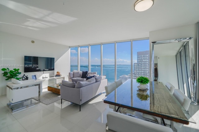 living room featuring light tile patterned floors and floor to ceiling windows