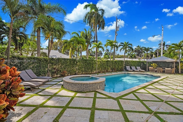 view of swimming pool featuring an outdoor hangout area, a patio, and an in ground hot tub