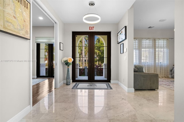 entrance foyer featuring french doors