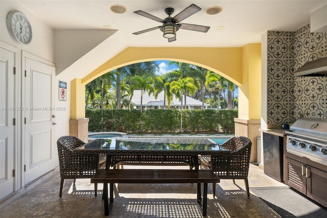 view of patio / terrace with exterior kitchen, a grill, and ceiling fan