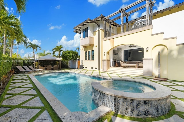 view of pool featuring a gazebo, a patio, ceiling fan, and an in ground hot tub