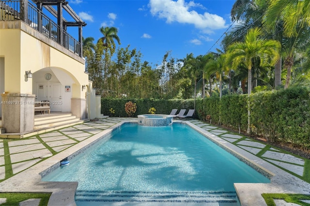 view of pool with an in ground hot tub and a patio