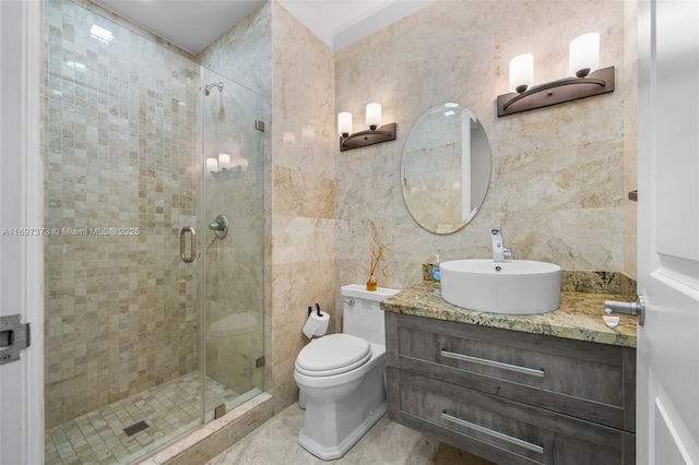 bathroom with vanity, tile walls, walk in shower, and toilet