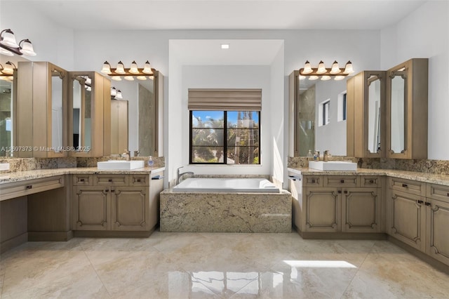 bathroom with vanity and tiled bath