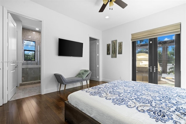 bedroom featuring multiple windows, ensuite bathroom, dark wood-type flooring, and access to exterior