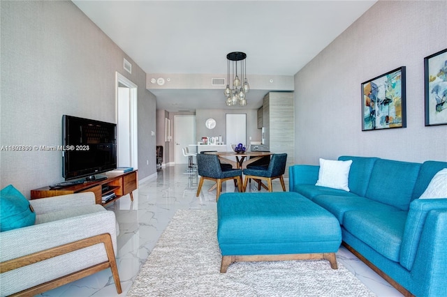 1300 S Miami Ave Unit 2104, Miami, FL 33130 - living area featuring light marble finish floors and a chandelier