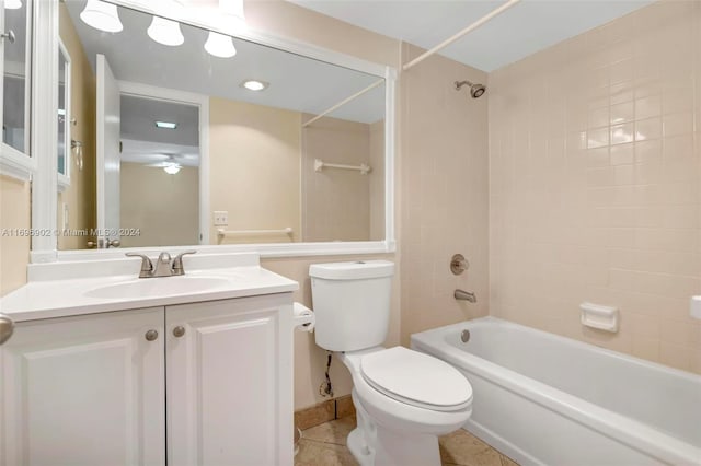 full bathroom with vanity, tile patterned floors, ceiling fan, tiled shower / bath combo, and toilet