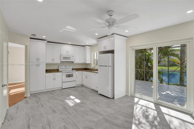 kitchen featuring ceiling fan, white cabinetry, white appliances, and sink