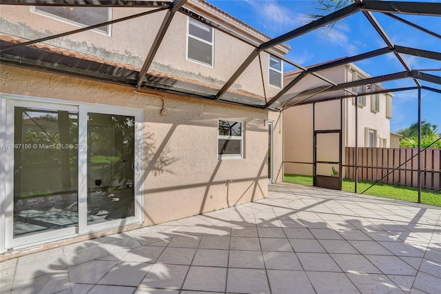 view of patio / terrace with glass enclosure