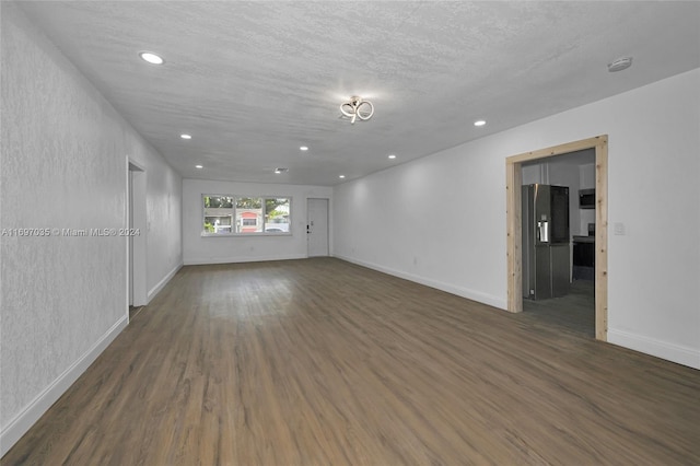 1369 NW 96th St, Miami, FL 33147 - empty room with wood finished floors, a smoke detector, recessed lighting, and a textured ceiling