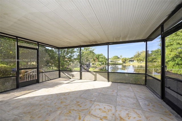 1369 NW 96th St, Miami, FL 33147 - unfurnished sunroom featuring a water view