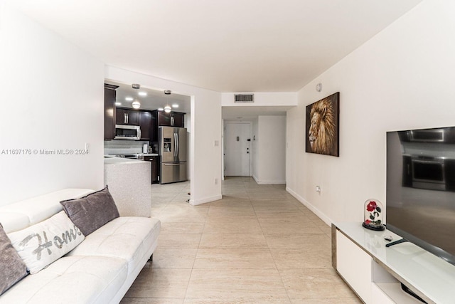 living room with light tile patterned floors