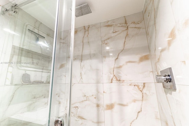 bathroom with a tile shower