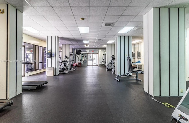 workout area with a drop ceiling