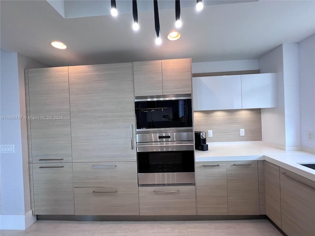 kitchen featuring backsplash and stainless steel appliances