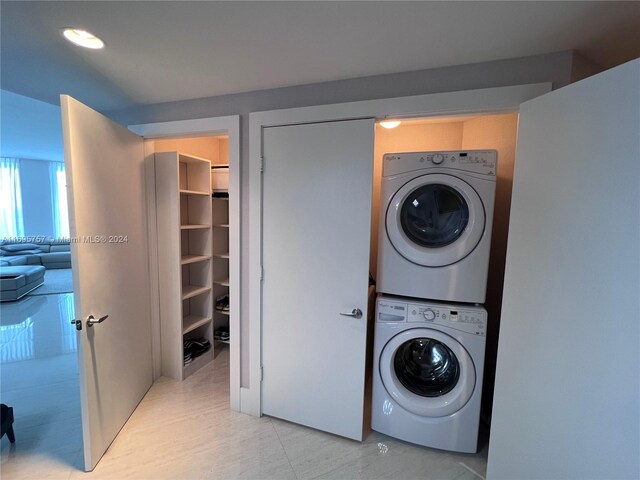 washroom with stacked washer / drying machine