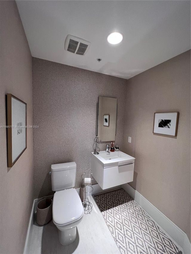 bathroom with vanity and toilet