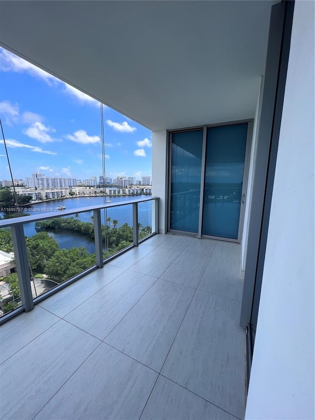 balcony featuring a water view