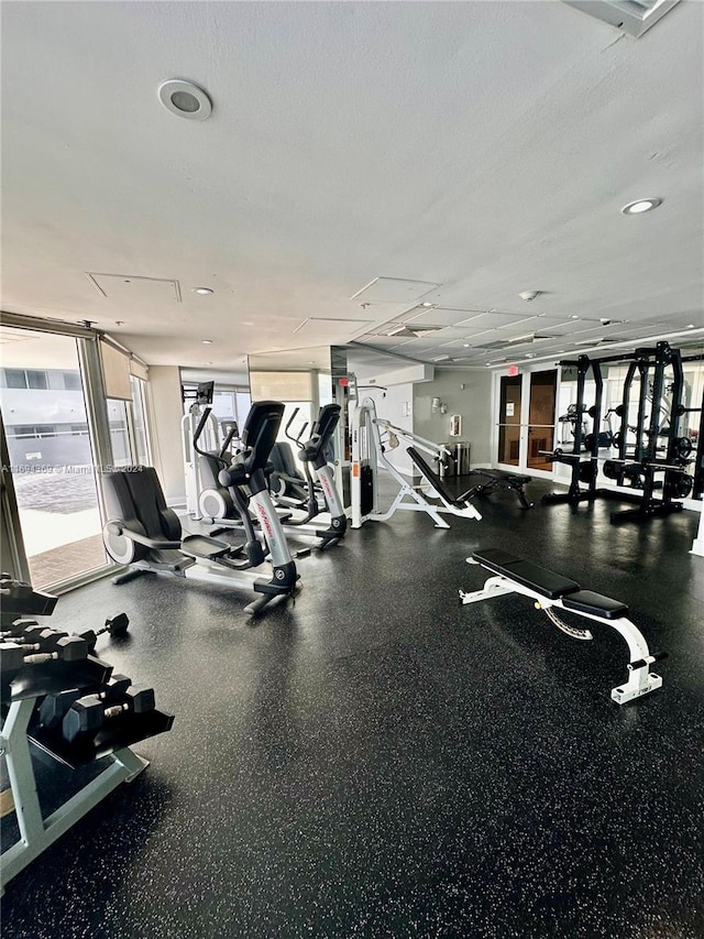 gym featuring a textured ceiling