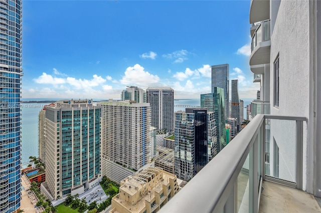 balcony featuring a water view