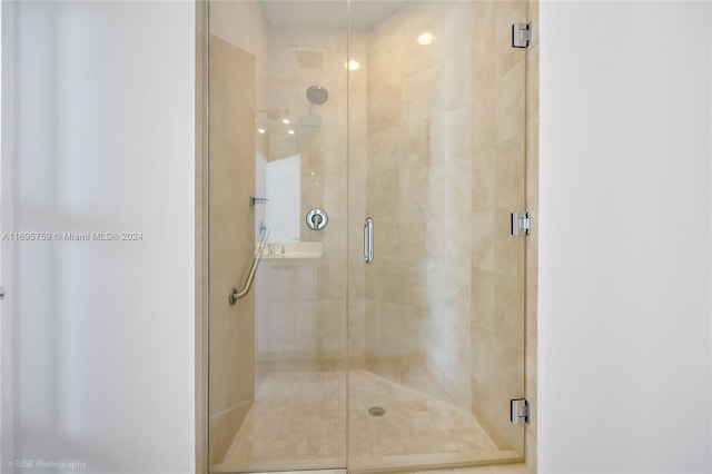 bathroom featuring an enclosed shower