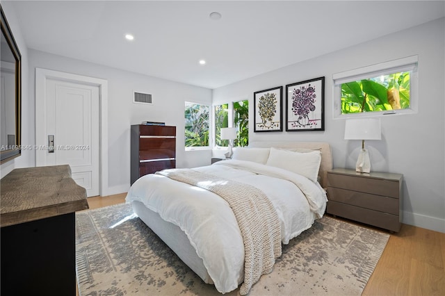 bedroom with hardwood / wood-style floors