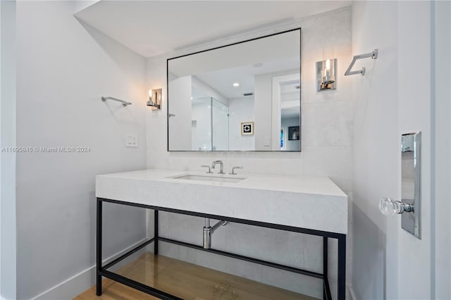 bathroom with wood-type flooring and vanity