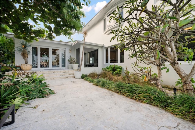 property entrance featuring french doors