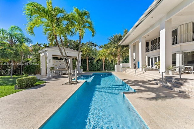 view of pool featuring a patio