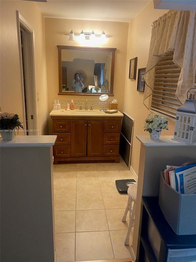 bathroom with tile patterned flooring and vanity