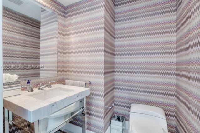 bathroom featuring tile patterned floors and toilet