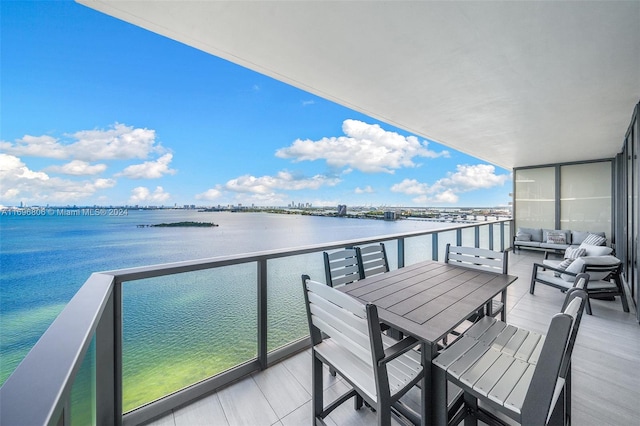 balcony featuring a water view