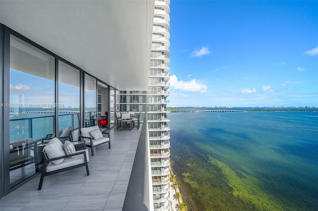 balcony featuring a water view