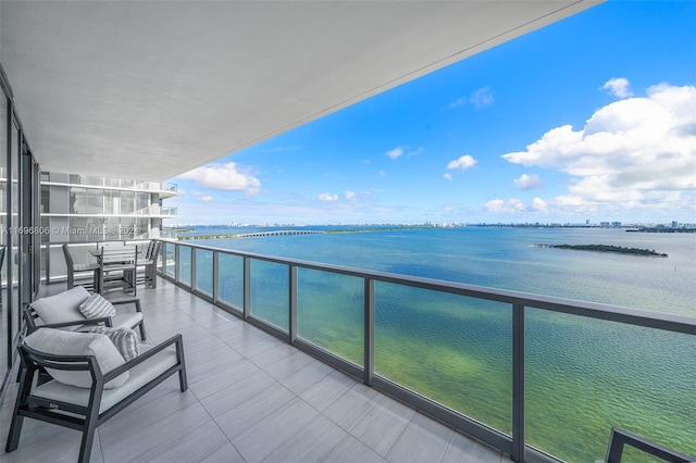 balcony featuring a water view