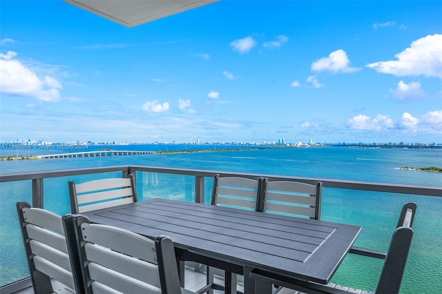 balcony featuring a water view