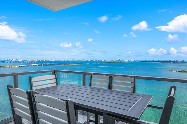 788 NE 23rd St Unit 2102, Miami, FL 33137 - balcony featuring a water view and outdoor dining space
