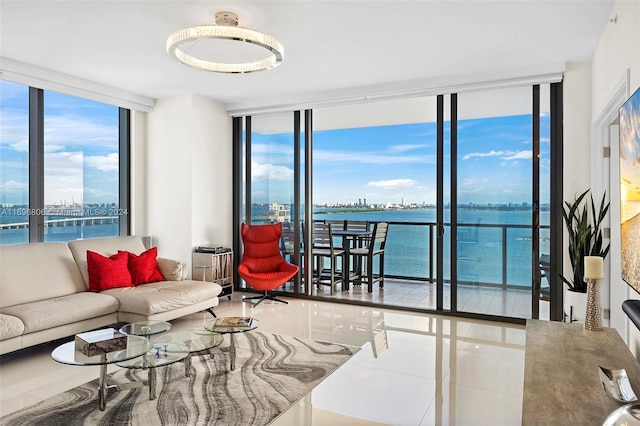 tiled living room with a water view and floor to ceiling windows