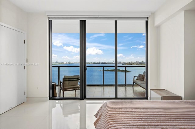 788 NE 23rd St Unit 2102, Miami, FL 33137 - tiled bedroom with expansive windows, multiple windows, a water view, and access to outside