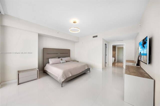 788 NE 23rd St Unit 2102, Miami, FL 33137 - bedroom featuring baseboards and light tile patterned floors