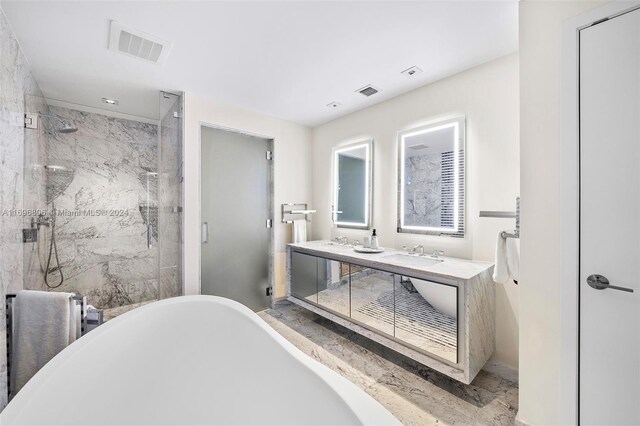 788 NE 23rd St Unit 2102, Miami, FL 33137 - bathroom with a marble finish shower, a freestanding tub, double vanity, and radiator heating unit