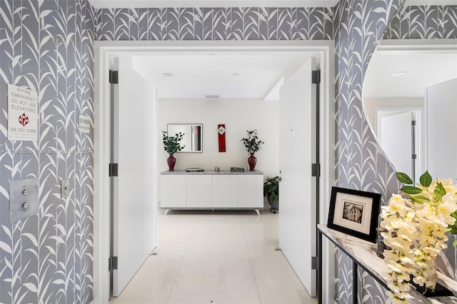 788 NE 23rd St Unit 2102, Miami, FL 33137 - hallway with wallpapered walls and light tile patterned floors