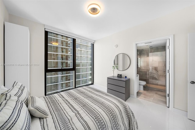 tiled bedroom featuring connected bathroom