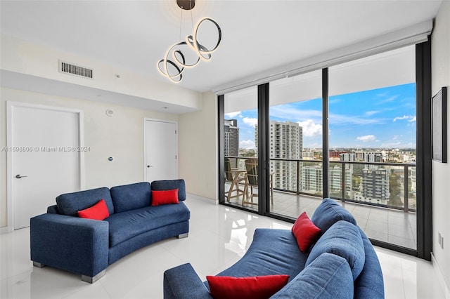 living room with light tile patterned floors and a wall of windows