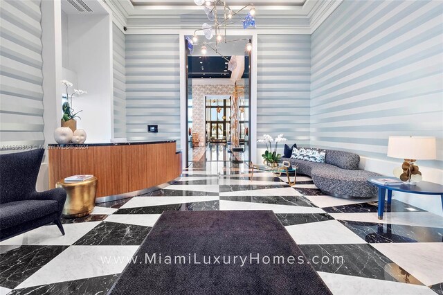 788 NE 23rd St Unit 2102, Miami, FL 33137 - reception area with wallpapered walls, a chandelier, and ornamental molding