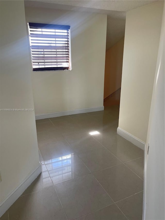 view of tiled spare room