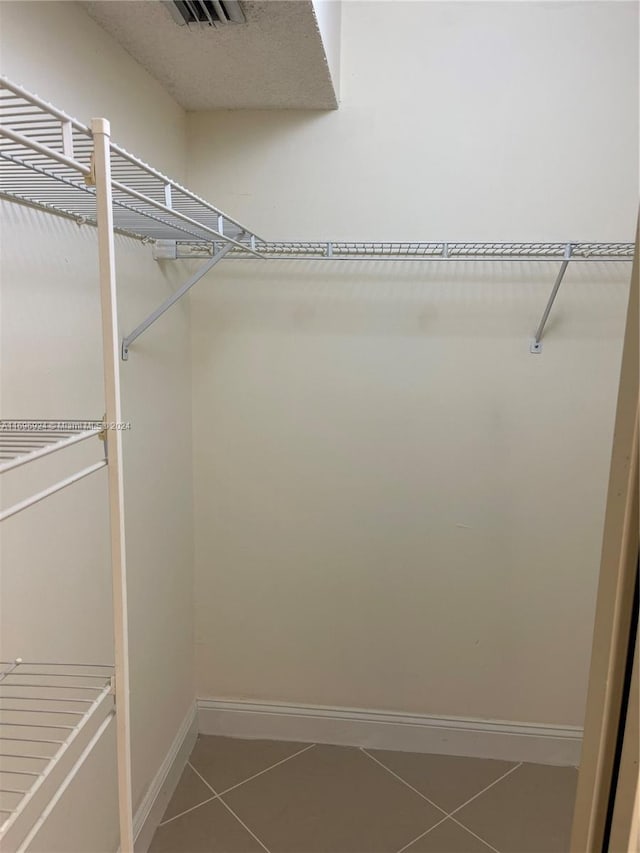 walk in closet featuring tile patterned floors