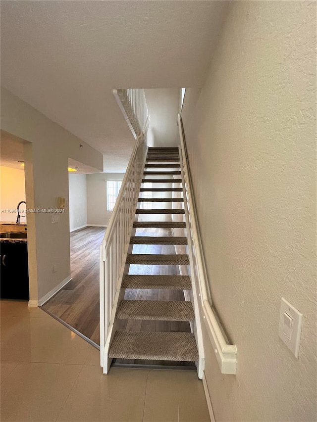 stairs with wood-type flooring